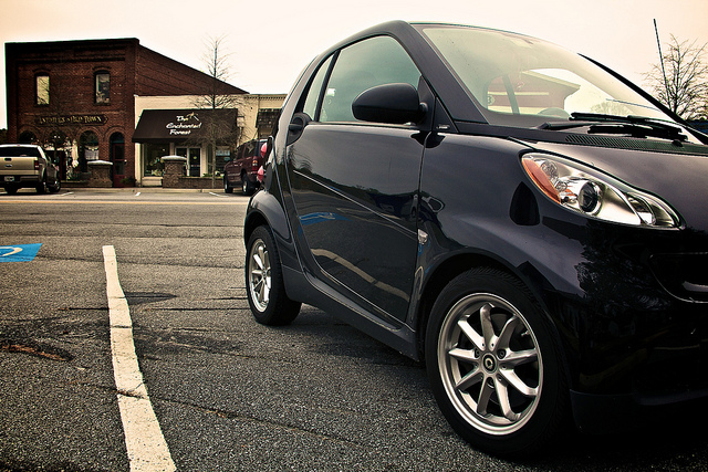 A smart car parked in old town Lilburn.