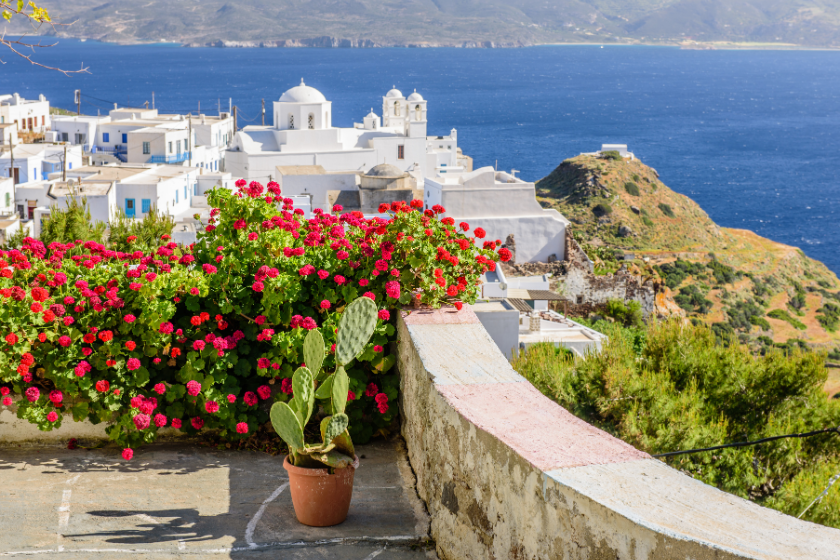 White houses and blue sea in Greece. Best affordable family vacations.