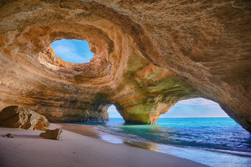 Sea caves in the Algarve in Portugal. Best affordable family vacations with HomeExchange. 