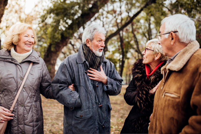 Swap your home with HomeExchange. 4 retirees chatting.