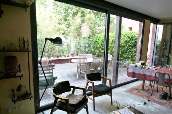 Une maison, un jardin, une cheminée et un barbecue au coeur des Puces, à 200m de Paris