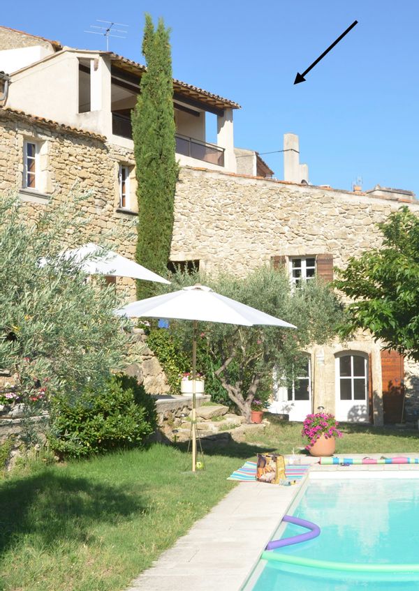 La maison de Gerard Old village house overlooking vineyards and Luberon hills.