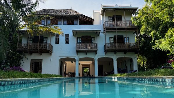 Oceanfront boutique villa in tropical garden with large pool and direct access to a secluded beach.