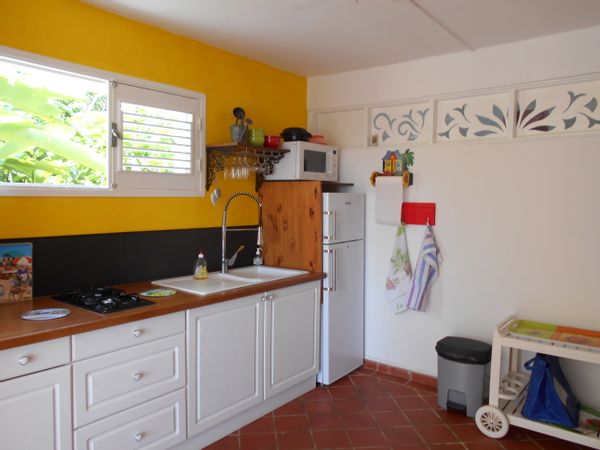 Appartement au coeur d'une ancienne maison créole dans un jardin luxuriant de 3000m2.