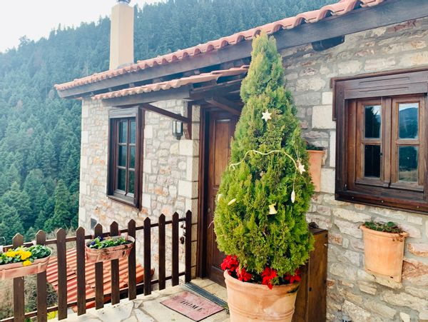 A cute stone house in a picturesque mountain village in central Greece